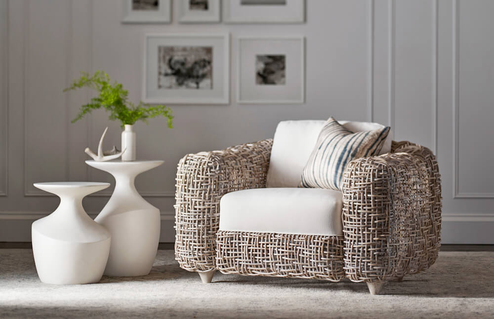 An intricately woven lounge chair is modern with a nod to traditional outdoor furniture.